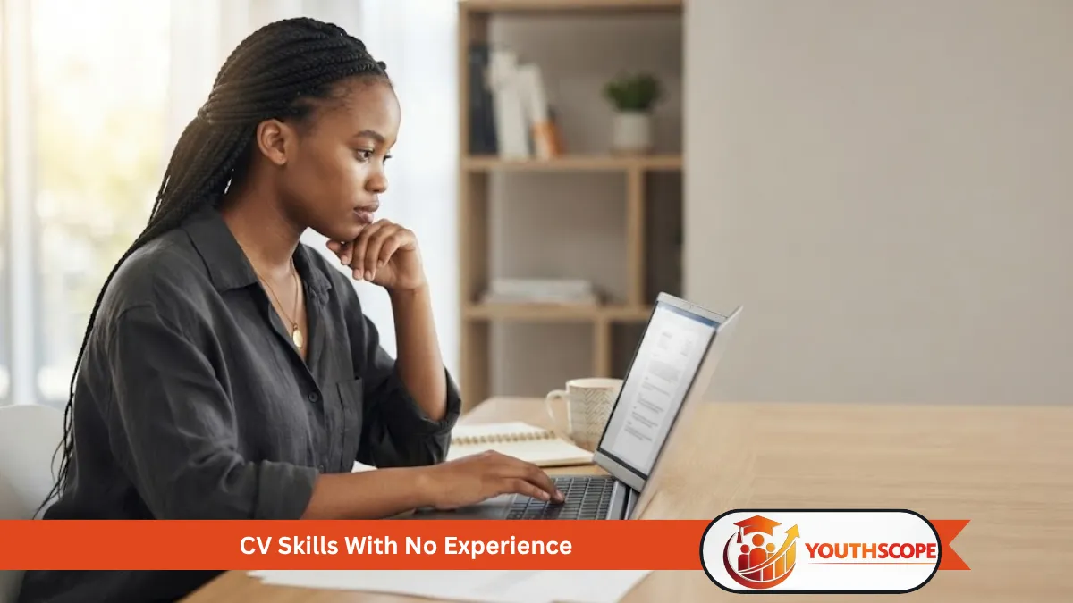 Young South African job seeker working on a CV using a laptop