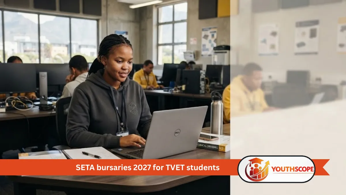 South African TVET student studying on a laptop in a college computer lab.